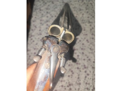 Escopeta paralela cal.12 perrillos