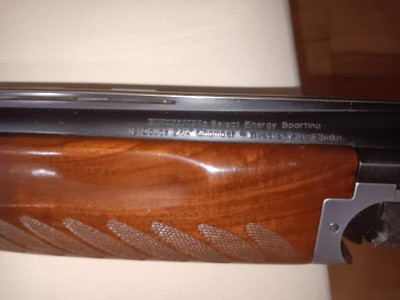 Escopeta Winchester superpuesta