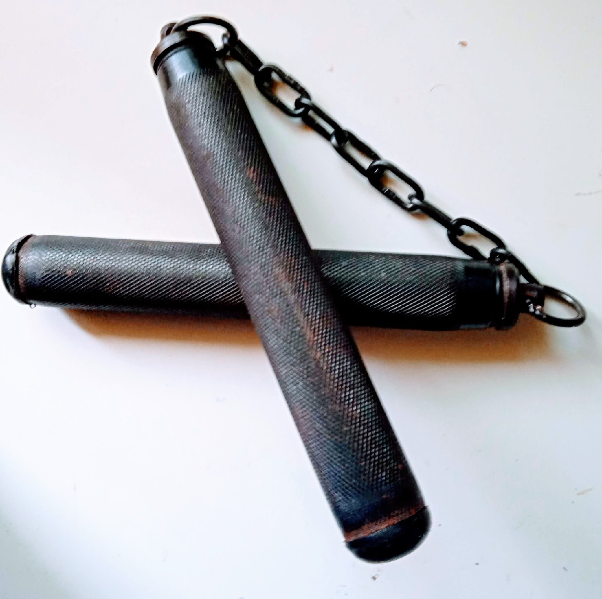Nunchaku de metal extensible